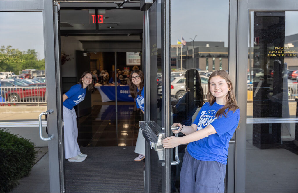 pre teens opening a business door